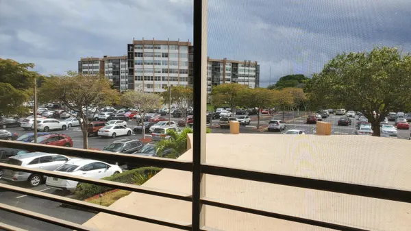 a view of swimming pool from a balcony