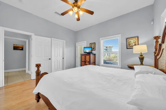 a view of an empty room with closet and a window