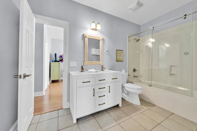 a bathroom with a sink vanity and a mirror