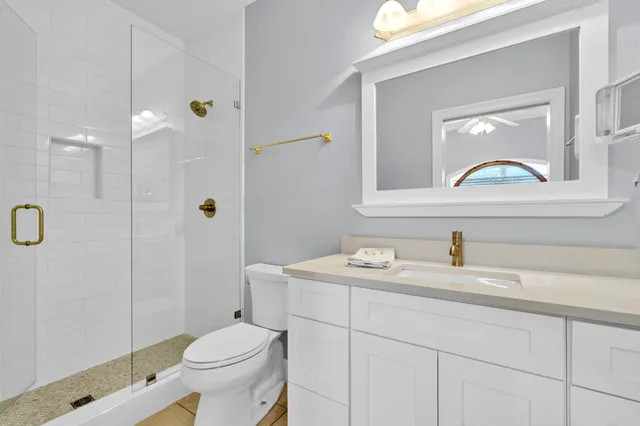 a bathroom with a sink a vanity and a mirror