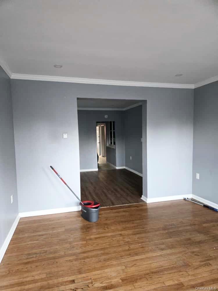 515 Summit Avenue Schenectady, NY 12307 - Photo 11 of 15 Unfurnished room with crown molding and wood finished floors