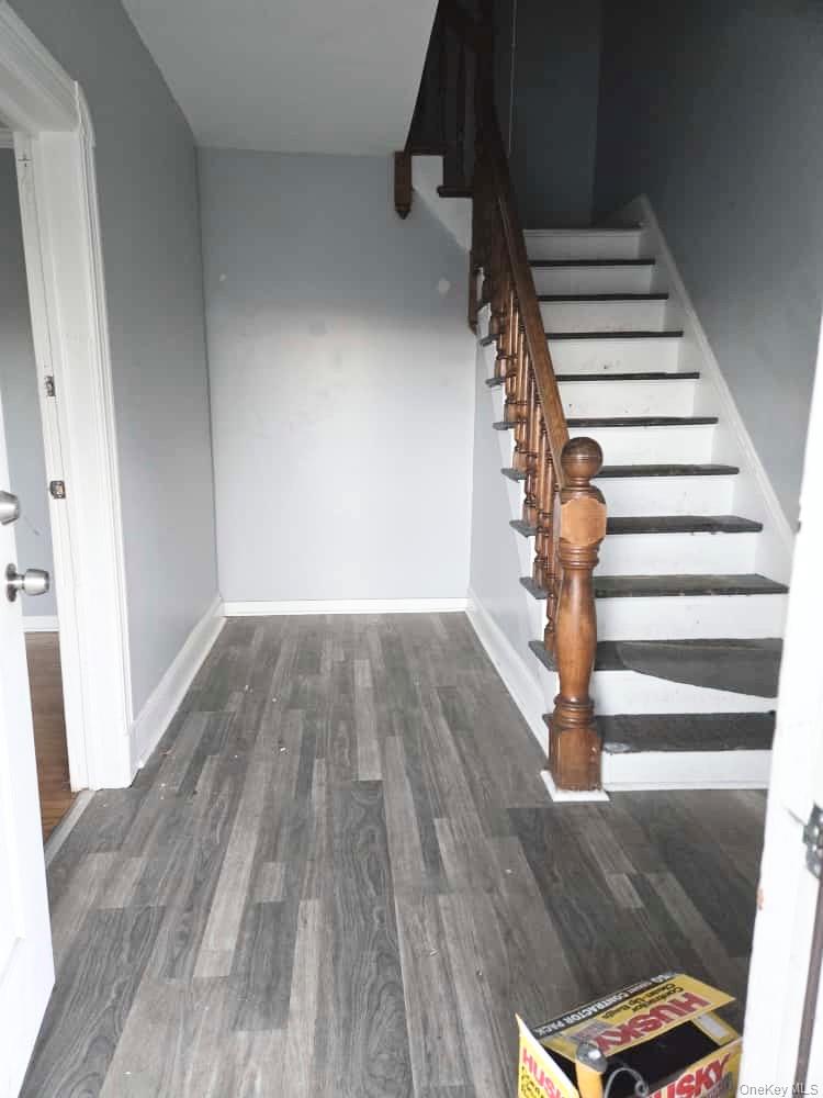 515 Summit Avenue Schenectady, NY 12307 - Photo 13 of 15 Stairway featuring wood finished floors and baseboards