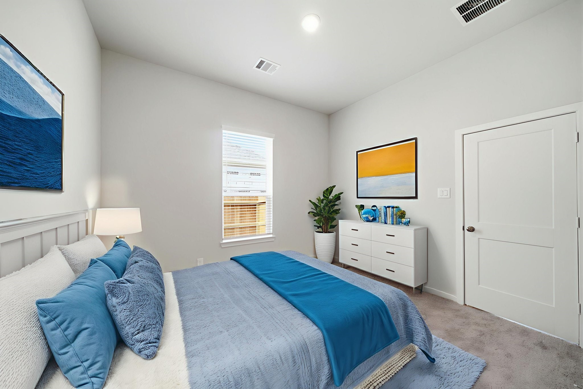 1593 Elm Place Angleton, TX 77515 - Photo 12 of 31 a bed room with a bed a couch and a window