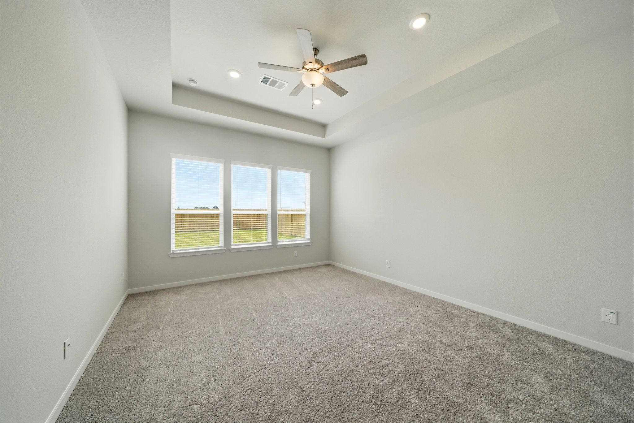 1593 Elm Place Angleton, TX 77515 - Photo 17 of 31 an empty room with a ceiling fan and window