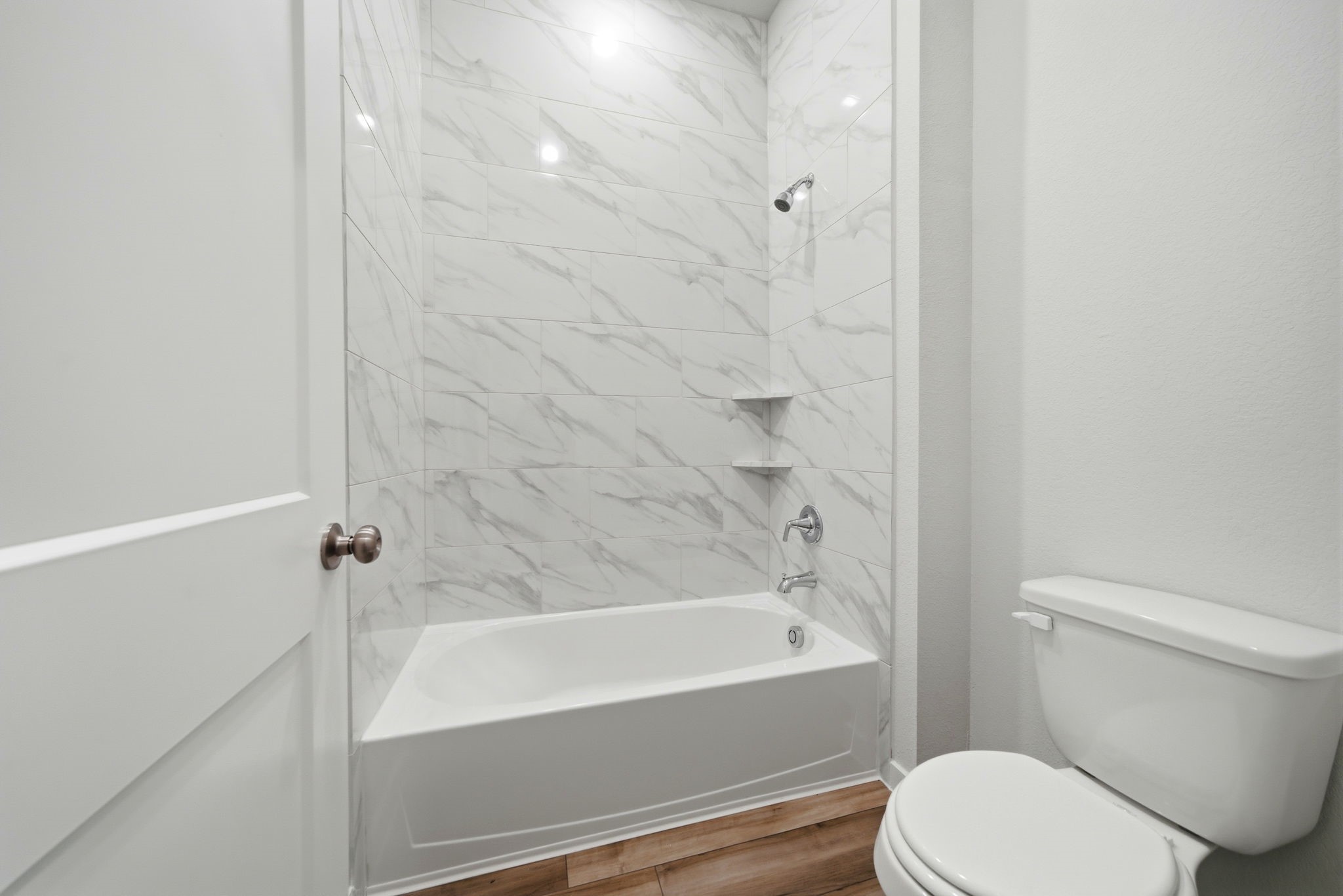 1593 Elm Place Angleton, TX 77515 - Photo 22 of 31 a bathroom with a toilet and a bathtub