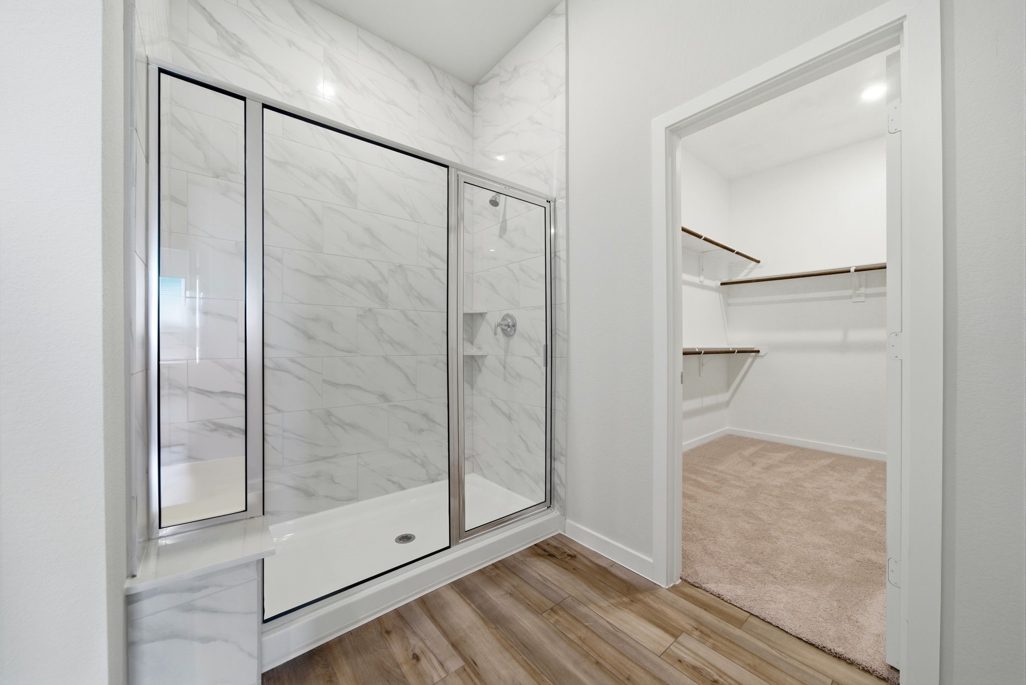 1593 Elm Place Angleton, TX 77515 - Photo 25 of 31 a bathroom with a glass shower door