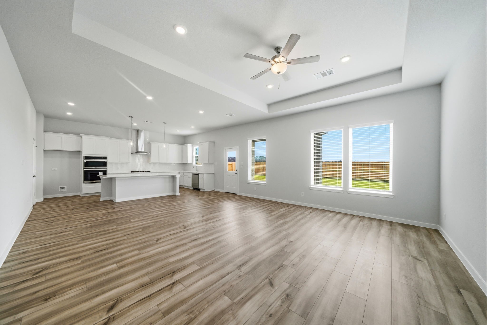 1593 Elm Place Angleton, TX 77515 - Photo 4 of 31 a view of an empty room with kitchen natural appliances