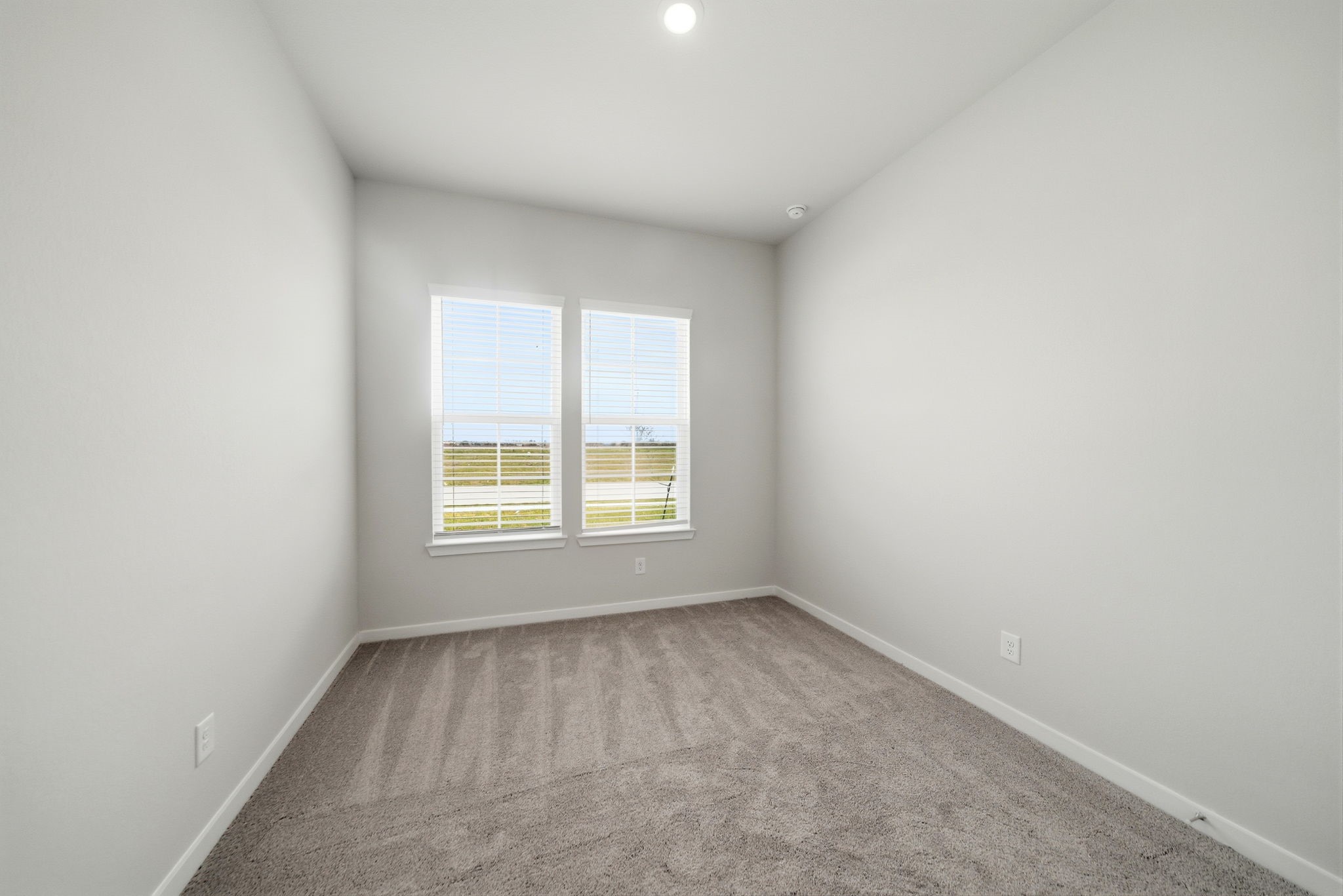 1593 Elm Place Angleton, TX 77515 - Photo 9 of 31 an empty room with a window