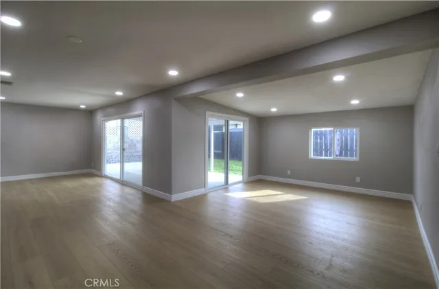 a living room with furniture and a painting on the wall