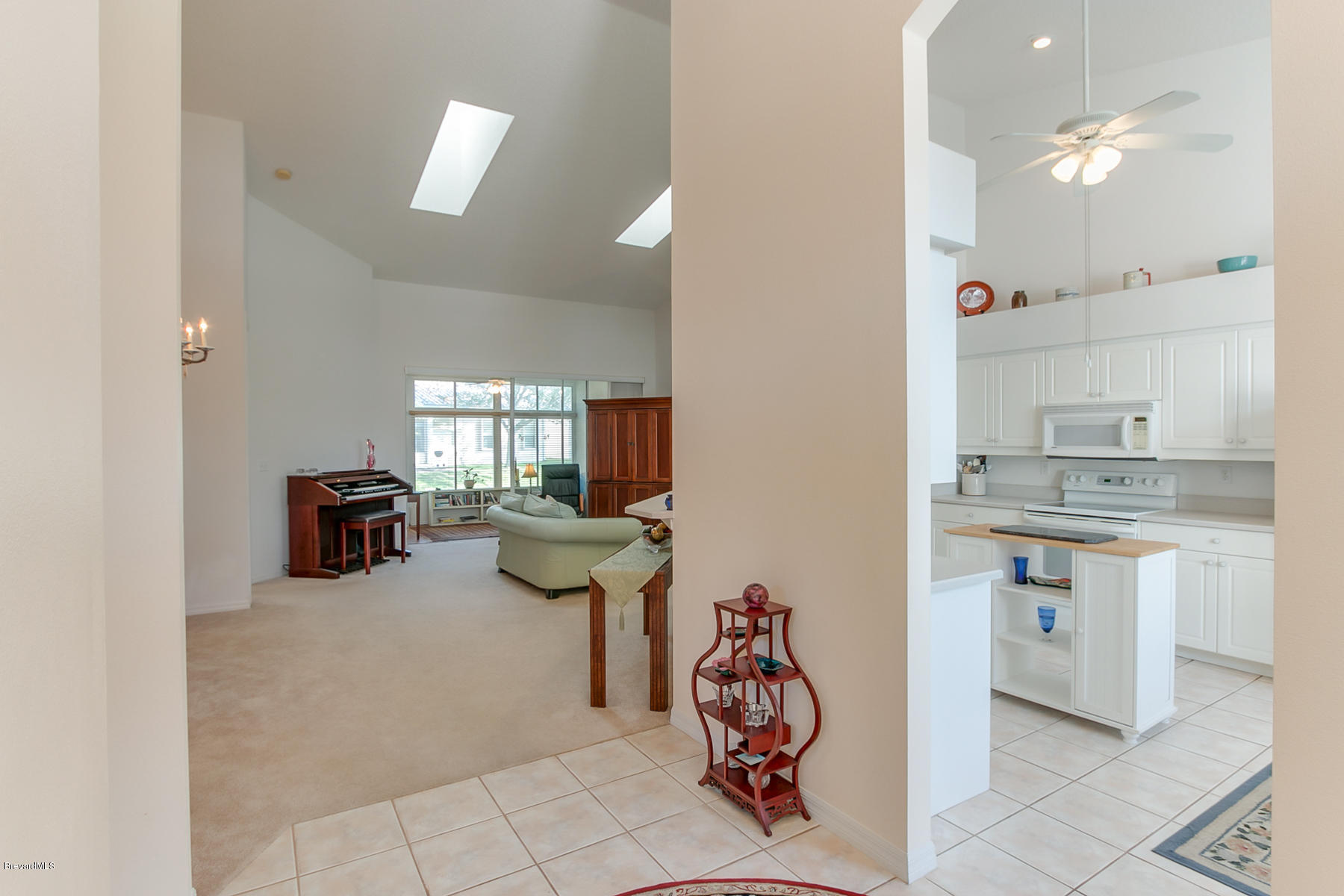 539 Renaissance Avenue Melbourne, FL 32940 - Photo 4 of 29 Foyer looking into Family room/Kitchen