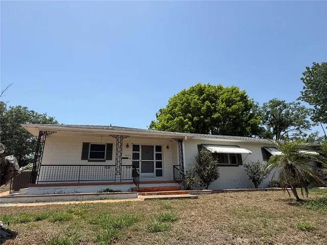 front view of a house with a yard