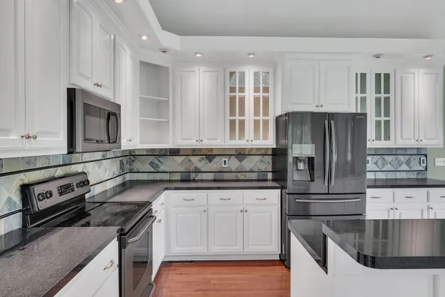 a kitchen with a sink and a large window