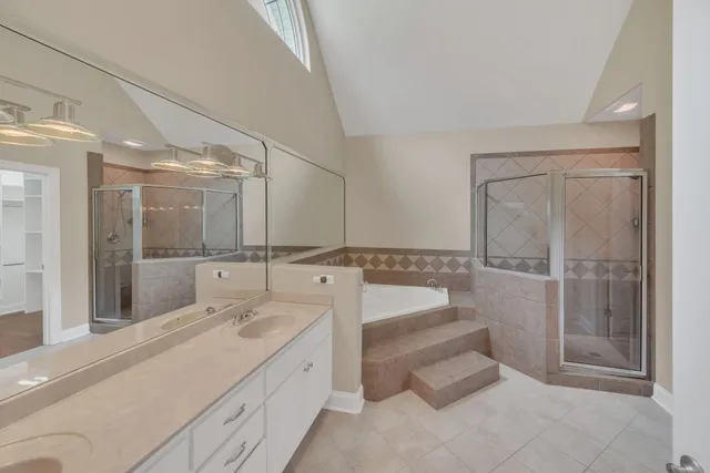 a bathroom with a shower and a sink