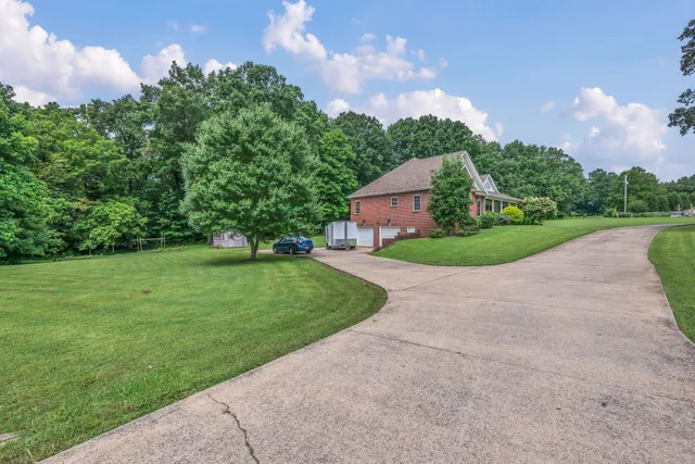 a front view of a house with a garden and porch
