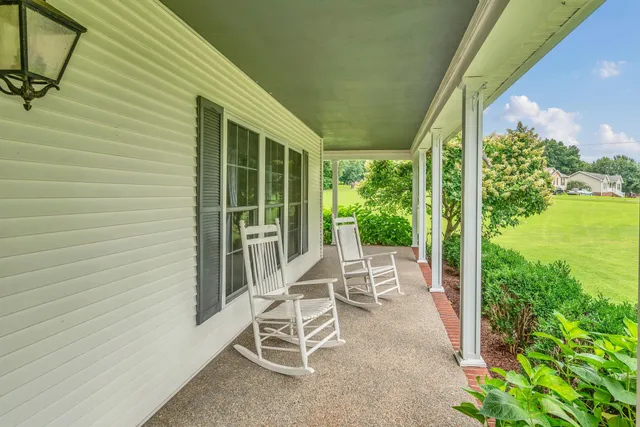 a view of a room with wooden floor and staircase