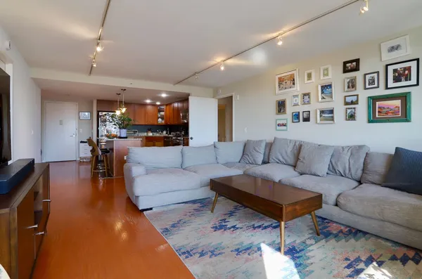 a living room with furniture and a large window