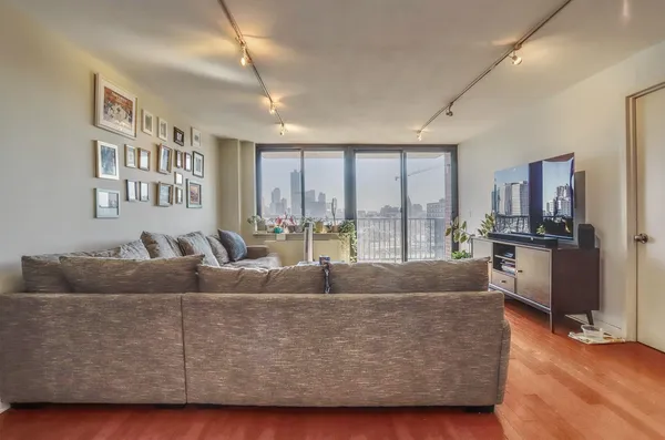 a bathroom with a granite countertop sink and a bathtub