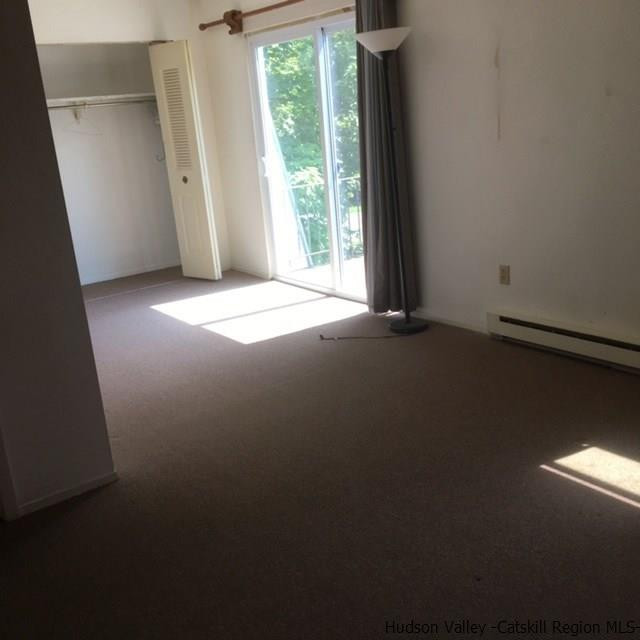 7 White Gate Road, Unit C Wappingers Falls, NY 12590 - Photo 4 of 6 an empty room with windows