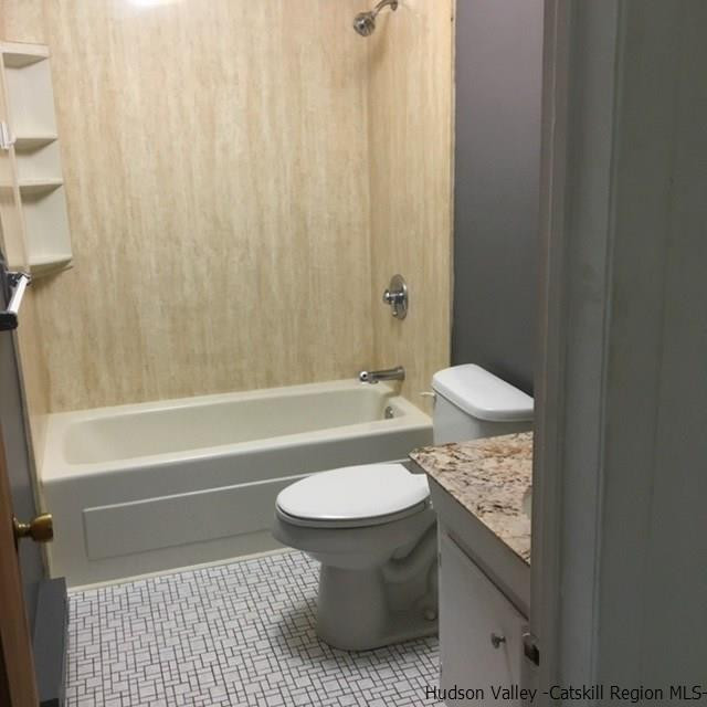 7 White Gate Road, Unit C Wappingers Falls, NY 12590 - Photo 5 of 6 a bathroom with a granite countertop sink toilet and shower