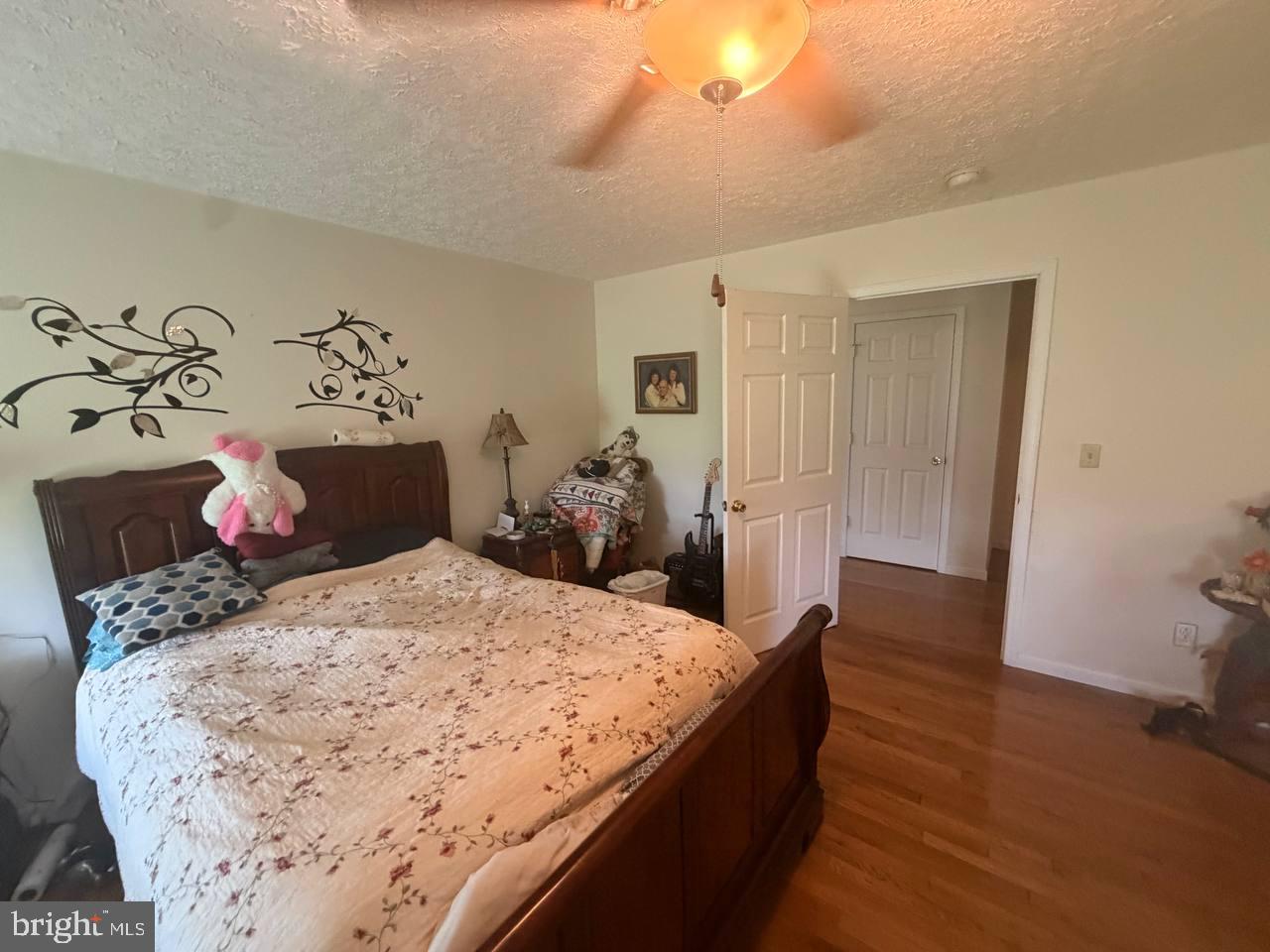 333 East Bailey Road Lewisburg, WV 24901 - Photo 31 of 57 Cozy bedroom with warm wooden accents.