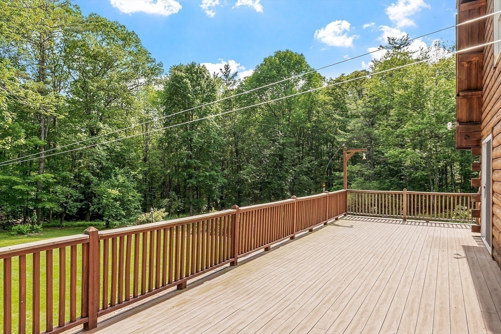 40 Lombard Road Hubbardston, MA 01452 - Photo 32 of 41 a balcony with trees in front of it