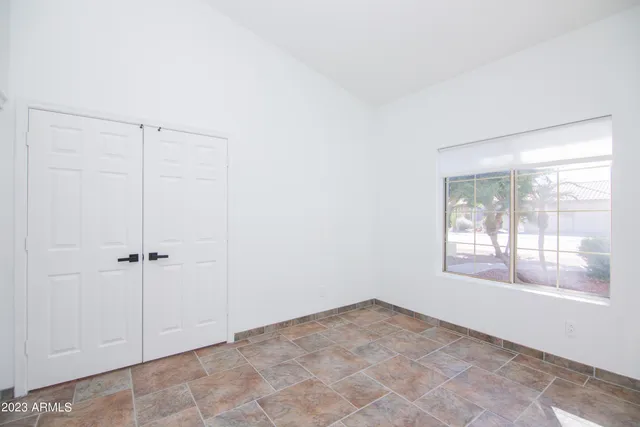 a view of an empty room with a window