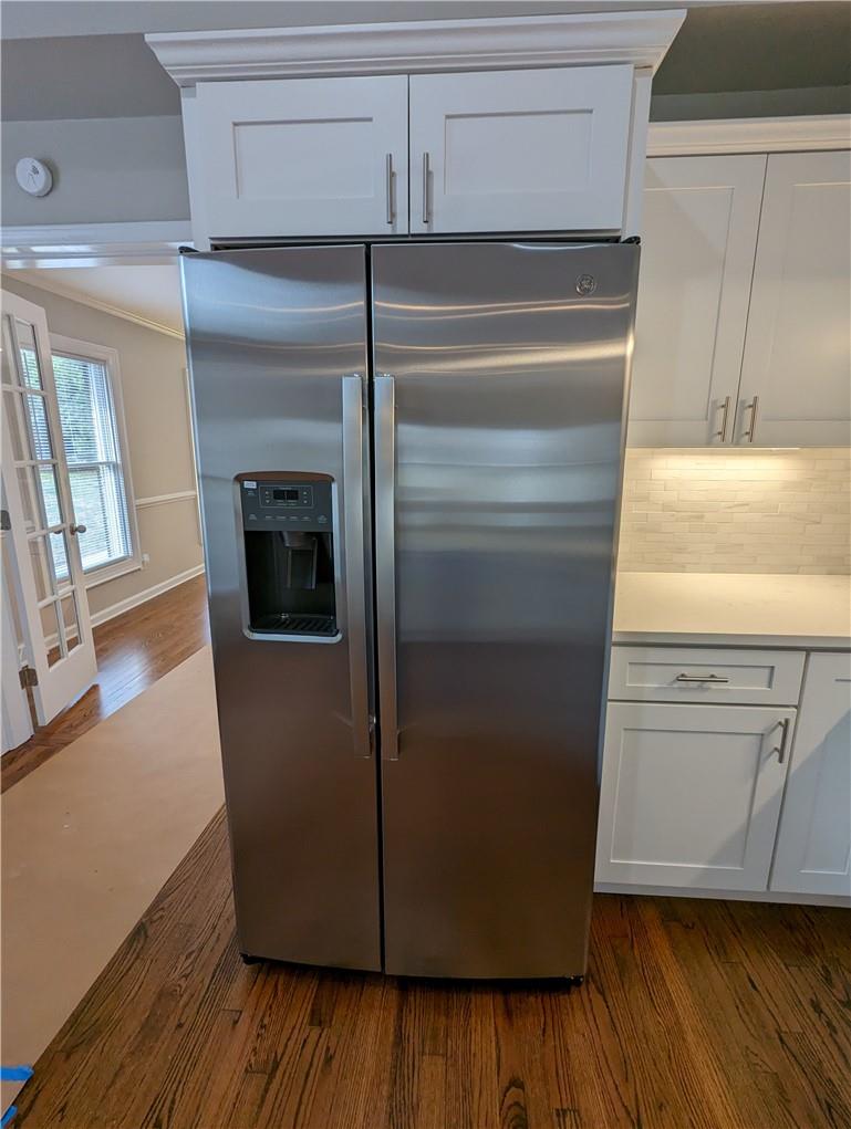 2619 Hinson Road Monroe, NC 28112 - Photo 13 of 39 a kitchen with a refrigerator and wooden floor