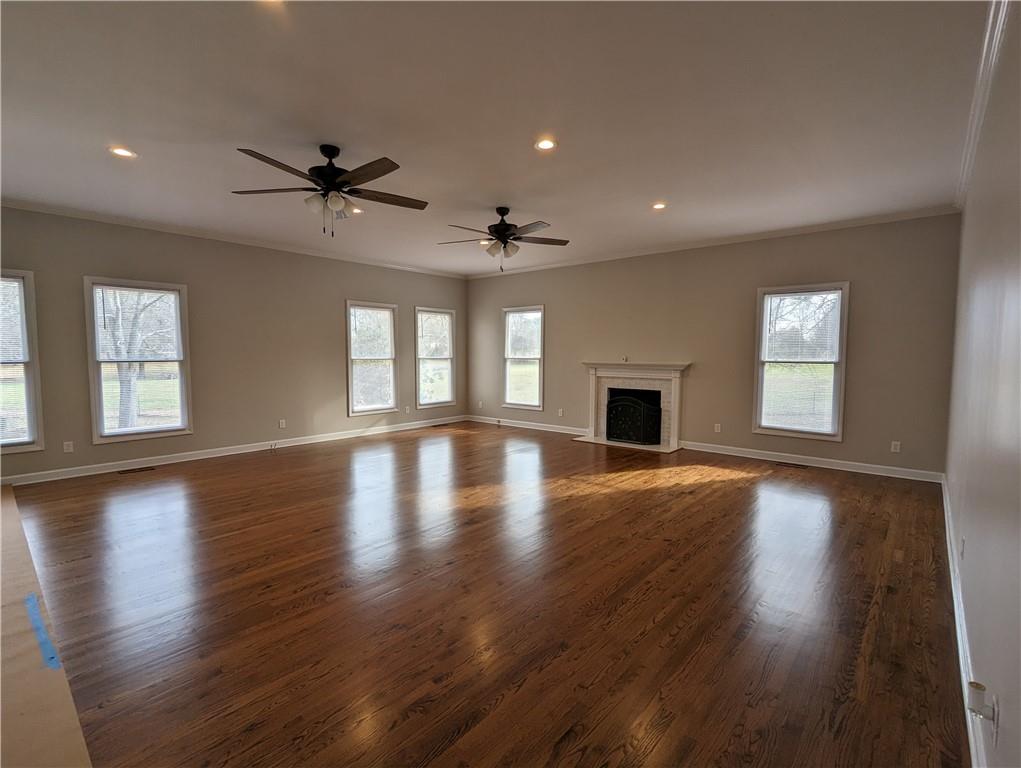2619 Hinson Road Monroe, NC 28112 - Photo 18 of 39 a view of an empty room with wooden floor and a window