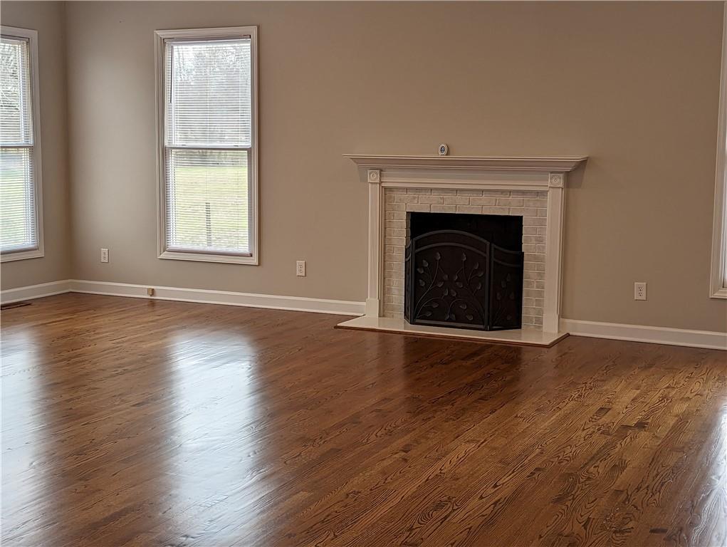 2619 Hinson Road Monroe, NC 28112 - Photo 19 of 39 an empty room with wooden floor and a window