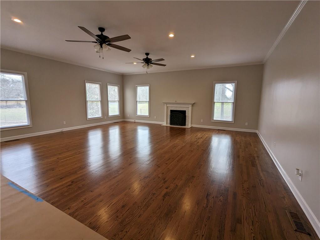 2619 Hinson Road Monroe, NC 28112 - Photo 20 of 39 a view of an empty room with a window and wooden floor