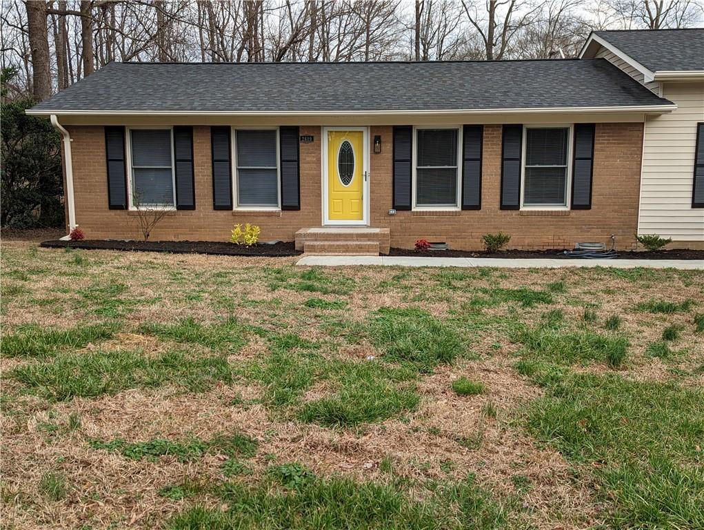 2619 Hinson Road Monroe, NC 28112 - Photo 2 of 39 a front view of a house with garden