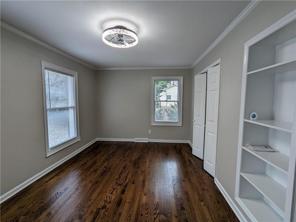 2619 Hinson Road Monroe, NC 28112 - Photo 25 of 39 an empty room with wooden floor and windows