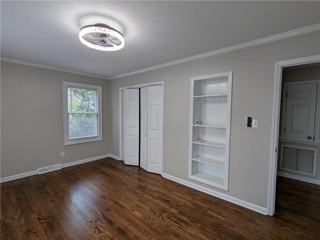 2619 Hinson Road Monroe, NC 28112 - Photo 26 of 39 a view of an empty room with a window and wooden floor