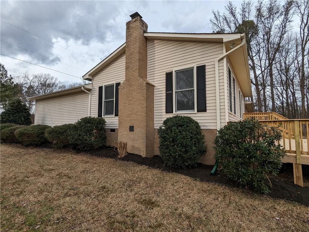 2619 Hinson Road Monroe, NC 28112 - Photo 36 of 39 a view of a house with backyard and a garden