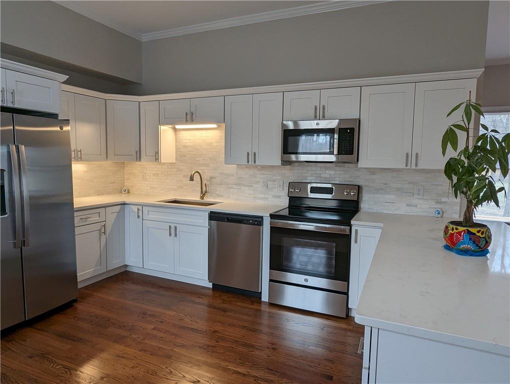 2619 Hinson Road Monroe, NC 28112 - Photo 8 of 39 a kitchen with granite countertop a sink cabinets and stainless steel appliances