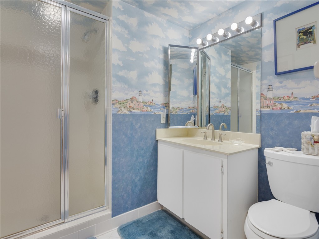 1880 Bay Road, Unit I319 Vero Beach, FL 32963 - Photo 19 of 36 a bathroom with a sink toilet and shower
