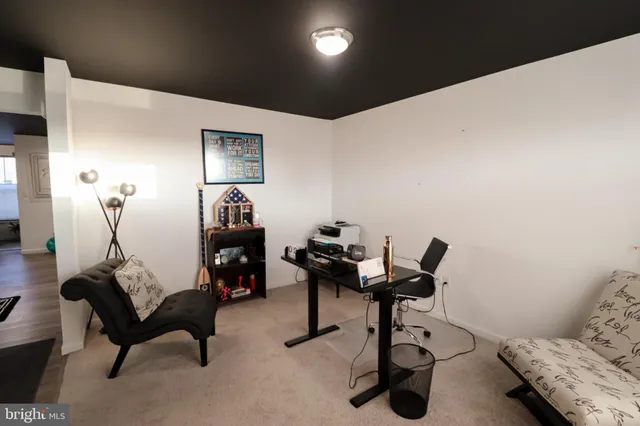 a room with furniture and gym equipment