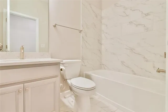 a bathroom with a sink a toilet and a bathtub