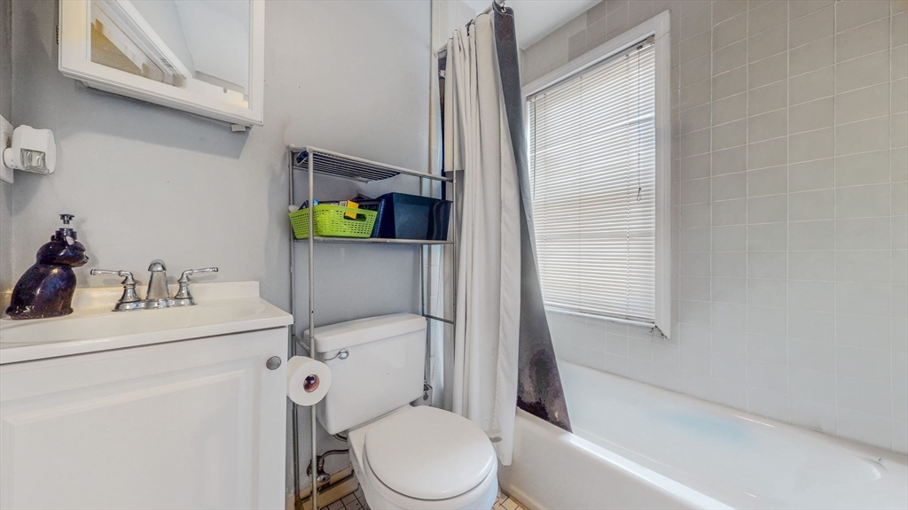 17-19 Crafts Street Newton, MA 02458 - Photo 13 of 24 a bathroom with a sink toilet and shower