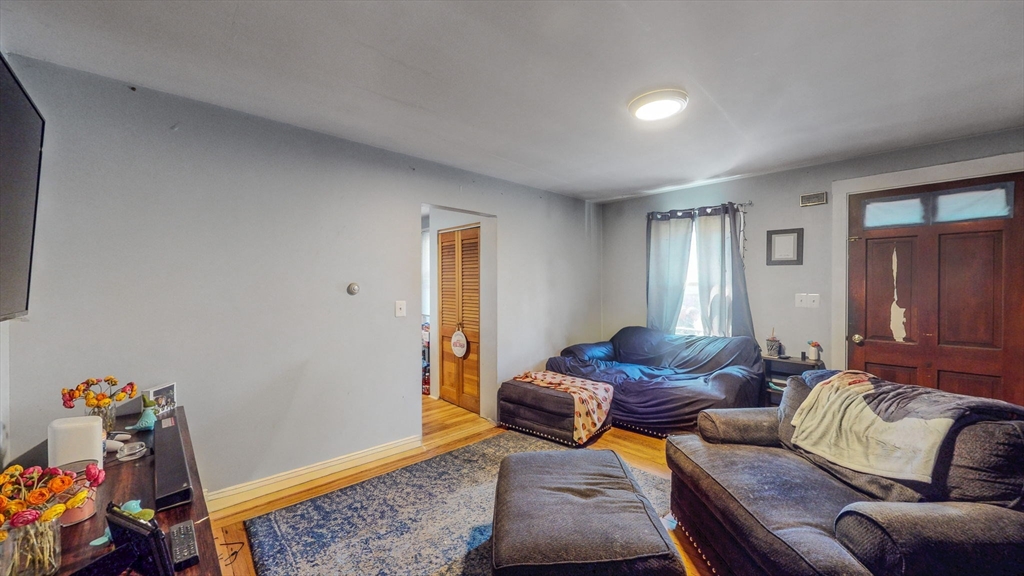 17-19 Crafts Street Newton, MA 02458 - Photo 5 of 24 a living room with furniture and a window