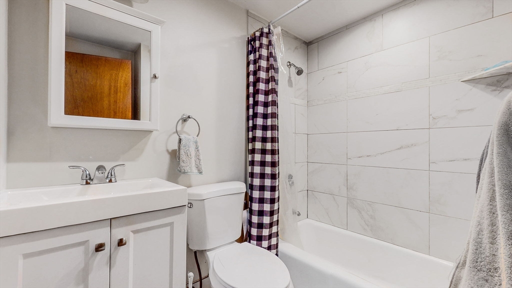 17-19 Crafts Street Newton, MA 02458 - Photo 7 of 24 a bathroom with a sink toilet and shower