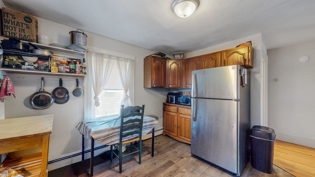 17-19 Crafts Street Newton, MA 02458 - Photo 8 of 24 a kitchen with stainless steel appliances a refrigerator a stove a sink and a cabinets