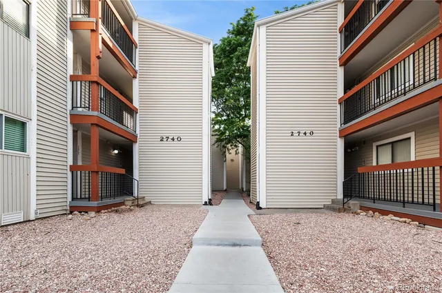 a view of a house with a door and a window