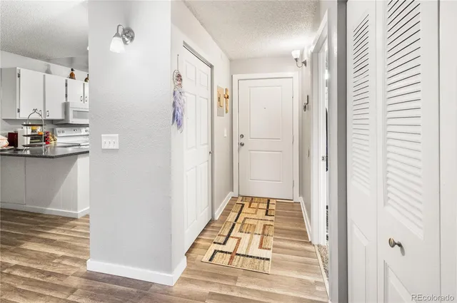 a view of a kitchen from the hallway