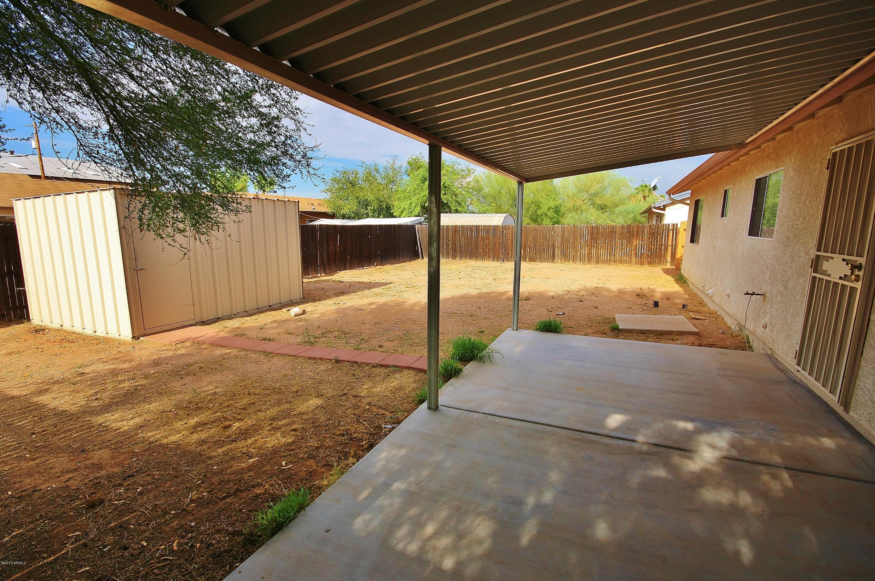 122 North Signal Butte Road Apache Junction, AZ 85120 - Photo 19 of 21 COVERED PATIO / BACKYARD