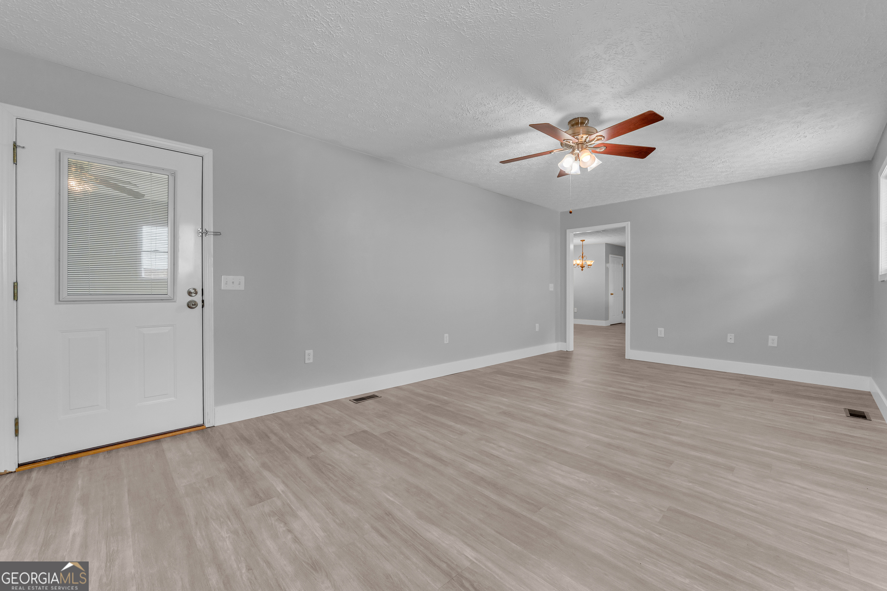 99 Parker Street Carnesville, GA 30521 - Photo 54 of 62 This is the room that could be used as an office, bedroom, exercise room - or maybe formal dining room'