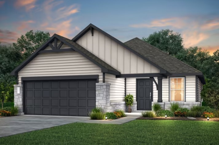 a front view of a house with a yard and outdoor seating