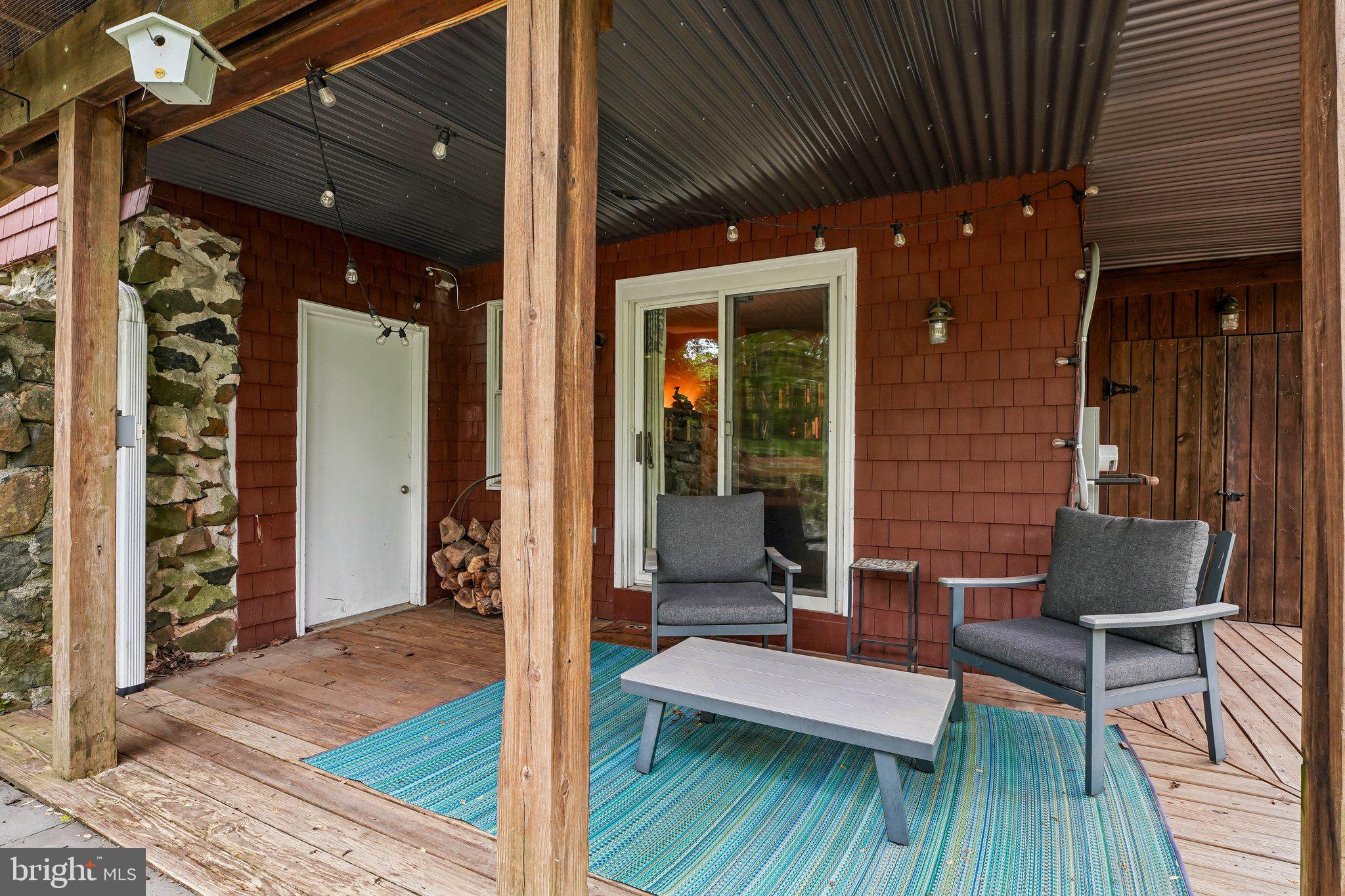 5716 Rusk Avenue Baltimore, MD 21215 - Photo 42 of 48 Lower level covered patio + door to workshop