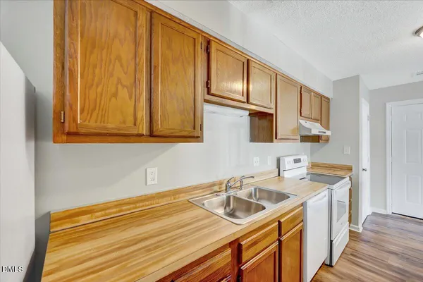 a utility room with a sink a washer and dryer