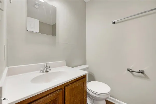 a bathroom with a sink toilet and vanity